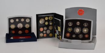 Royal Mint proof coin collections, comprising year 2000, 2001 and a 2010 set in leather case