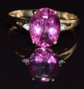 A 9k gold ring set with an oval cut synthetic pink sapphire, size P, 1.8g