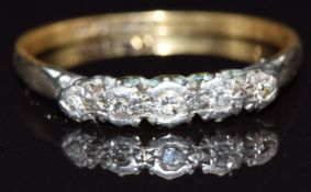 An 18ct gold ring set with five diamonds in a platinum setting, size P/Q, 2.1g