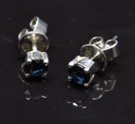 A pair of 14k white gold earrings set with a sapphire approximately 0.2cts to each, 1.4g