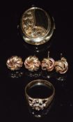 A 9ct gold ring set with a diamond and sapphires, two pairs of bi-coloured 9ct gold knot earrings