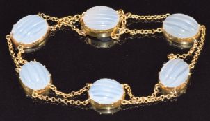 Victorian yellow metal bracelet set with carved moonstone cabochons, 9.3g