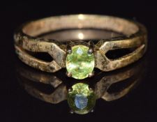 A 9k gold ring set with an oval cut sphene, size M, 2.4g