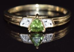 A 9ct gold ring set with peridot and diamonds, size N, 1.8g