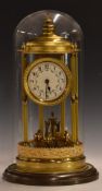 Early to mid 20thC brass gilt anniversary clock with reeded columns and finial, in bandstand design,