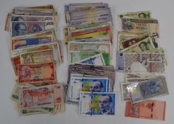 A collection of world banknotes, largely Asian and some Middle Eastern, includes £160 of Iranian