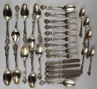 American white metal canteen of Art Nouveau cutlery, comprising five dessert spoons, twelve table