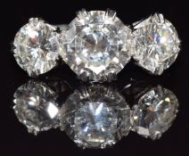 A platinum ring set with three round brilliant cut diamonds, the centre diamond approximately 2.5cts