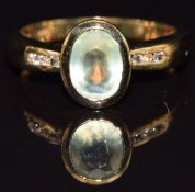 A 9k gold ring set with prehite and topaz, size M, 3.1g