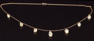A c1900 9ct gold necklace set with blister pearls in small cages, 8.3g
