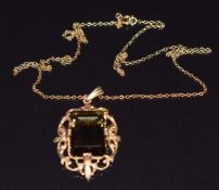 A 9ct gold pendant set with a smoky quartz on 9ct gold chain, 7.3g