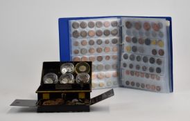 An amateur collection of overseas coinage contained in both an album and a vintage cashbox