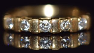 An 18ct gold half eternity ring set with diamonds, size L, 2.5g
