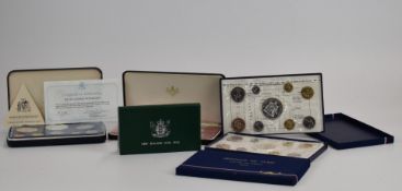 Two Monnaie de Paris 1974 coin sets and a New Zealand proof set, all with silver content, with