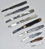 A collection of pocket knives including two mother of pearl handled silver fruit knives, one with