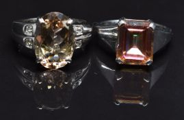 Two 9ct white gold rings, one set with treated topaz the other with zircon, size N, 10.9g