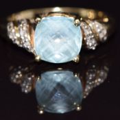 A 9ct gold ring set with blue topaz and diamonds, size M, 3.5g