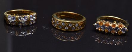Three 9ct gold rings set with quartz, size N, 11.3g