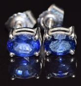 A pair of 18ct white gold earrings set with an oval cut sapphire approximately 0.5ct to each, 2g