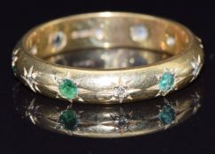 An 18ct gold eternity ring set with diamonds and emeralds, size M, 4.3g