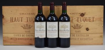 Nine bottles of Chateau Haut Tuquet Bordeaux 1993, 75cl, 12% vol, in three wooden bases