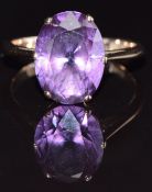 A 9ct gold ring set with a purple synthetic sapphire, size M, 3g