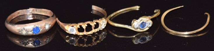 Two sections of 18ct gold ring (1.6g), a 9ct gold ring and a section of yellow metal ring (2.2g)