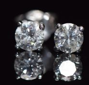 A pair of 18ct white gold earrings set with a round brilliant cut diamond of approximately 0.3ct