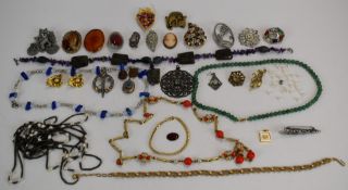 A collection of costume jewellery including beads, amethyst necklace, Victorian locket, Miracle