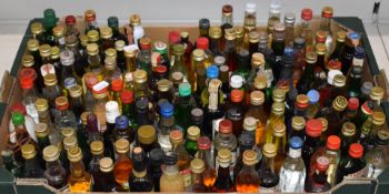 A collection of alcohol miniatures including Dubonnet Blonde, Negrita Rhum, Cavalier Rum, Midori