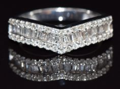 A 9ct white gold half eternity ring set with baguette and round cut diamonds, size K, 3g