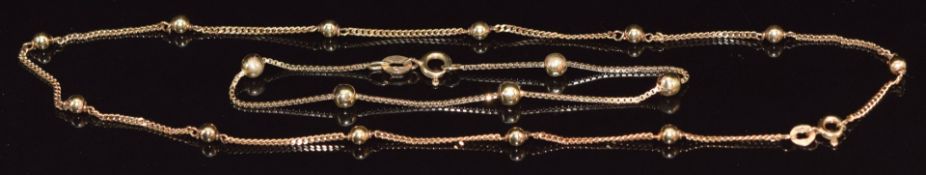 A 9ct gold necklace and matching bracelet made up of curb and sphere links, 6.5g