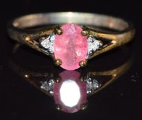 A 9k gold ring set with pezzottaite and diamonds, size N, 1.9g