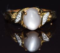 A 9k gold ring set with moonstone and topaz, size N, 3.8g