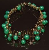 A 1950's bespoke necklace set with green agate beads