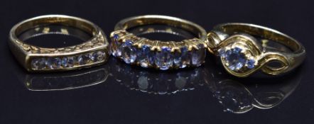 Three 9ct gold rings set with paste, size N, 9.2g
