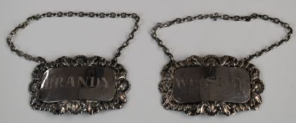 Pair of hallmarked silver bottle tickets comprising Brandy and Whiskey, London 1964 and 1965,