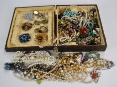 A collection of costume jewellery including French jet brooch, beaded necklaces, vintage earrings,