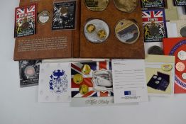 A collection of Westminster and other commemorative coins to include D-Day, Churchill and other gold