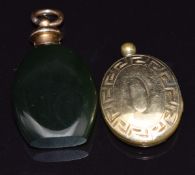 An agate charm/ pendant with yellow metal pendant mount and a Victorian locket