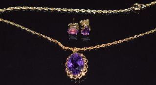 A 9ct gold necklace set with an oval cut amethyst and a pair of 9ct gold earrings set with an