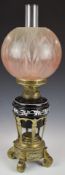 19thC oil lamp with ornate brass stand and glass shade, H59cm