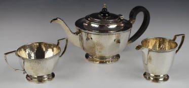 Mappin & Webb George V hallmarked silver three piece tea set with Arts & Crafts style hammered