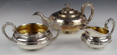 Georgian hallmarked silver three piece tea set of squat form with floral finial, length of teapot