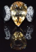 A 9k gold ring set with a pear cut citrine and topaz, size M, 6.1g