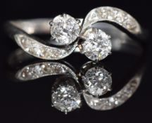 A platinum ring set with diamonds in a twist setting, c1915, size L, 2.7g