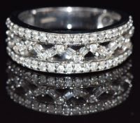 A 9ct white gold ring set with round and baguette cut diamonds, size M/N, 5.3g