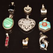 A collection of silver jewellery including malachite pendant, pierced pendant set with paste,