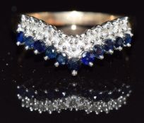 A 9ct gold ring set with diamonds and sapphires in a V setting, size P, 2.7g
