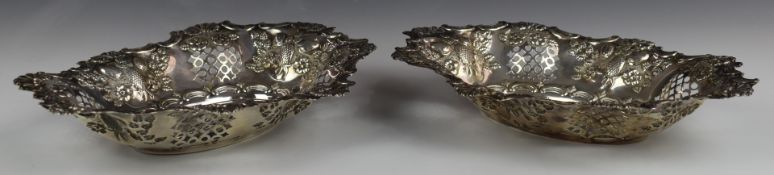 Pair of Victorian hallmarked silver baskets with embossed and pierced decoration, Birmingham 1897,